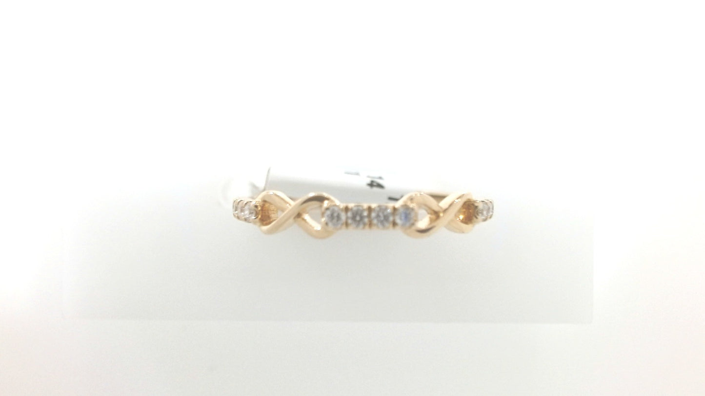 Gold ring with diamonds on a white background