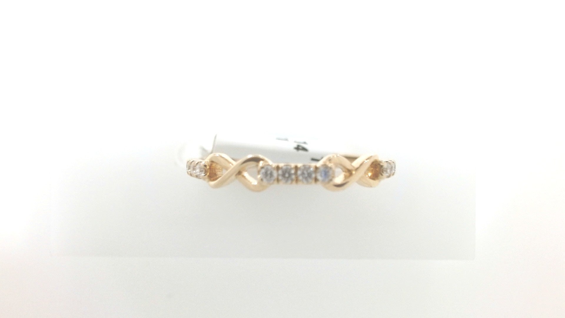 Gold ring with diamonds on a white background