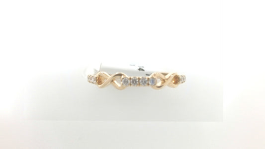Gold ring with diamonds on a white background